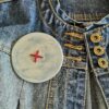 Big button brooch inn blue with red stitching
