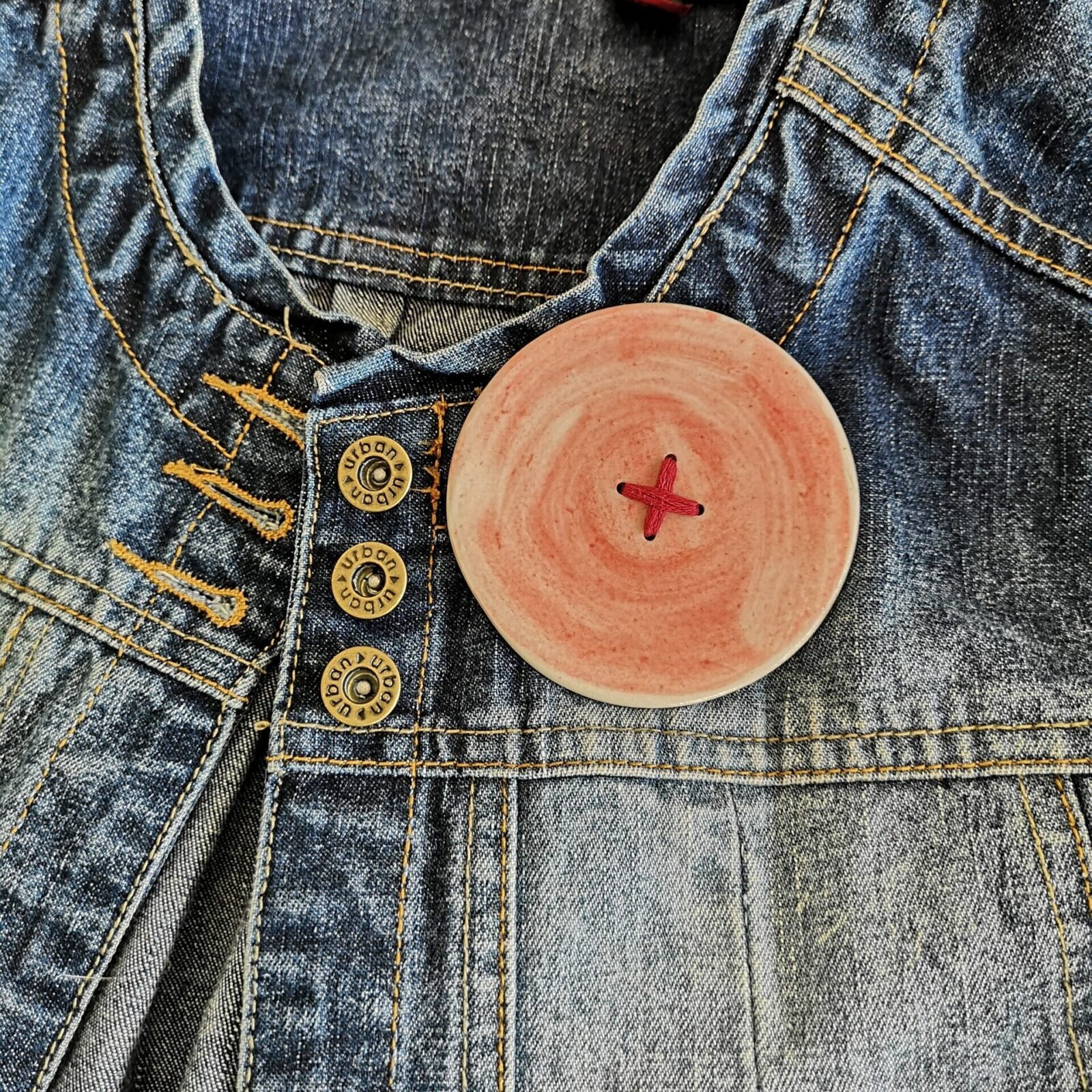 Big ass button brooch in red with red stitching